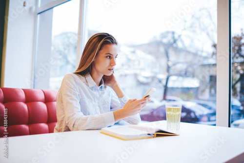 Free Download Young woman touching screen of smartphone - GFXLoad