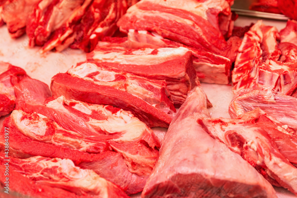 Fresh red meat on the market counter. Healthy eating. Close-up. Fresh red meat on the market counter. Healthy eating. Close-up.