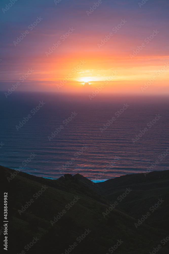 Sun setting on the atlantic ocean from the top of Jaizkibel hills