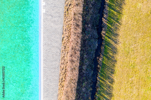 a pool and a meadow abstract background from above photo