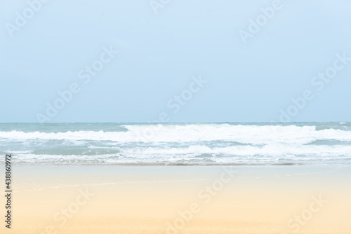 Vintage and retro toning of tropical beach with blue sky and clear sea which including of a wooden umbrella and chair in sunrise time with vintage retro tone. Vacation time as concept.