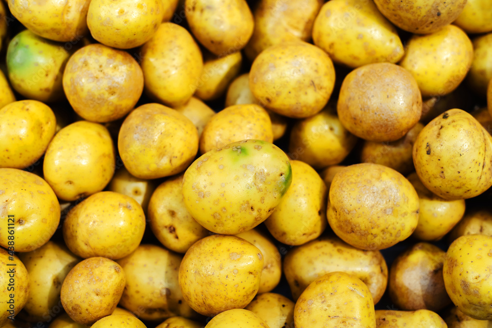 Young potatoes of yellow color on the counter of the store. Close-up Young potatoes of yellow color on the counter of the store. Close-up