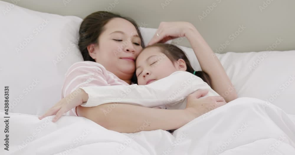 mother and daughter are sleeping on the bed 2 mother and daughter are sleeping on the bed 2