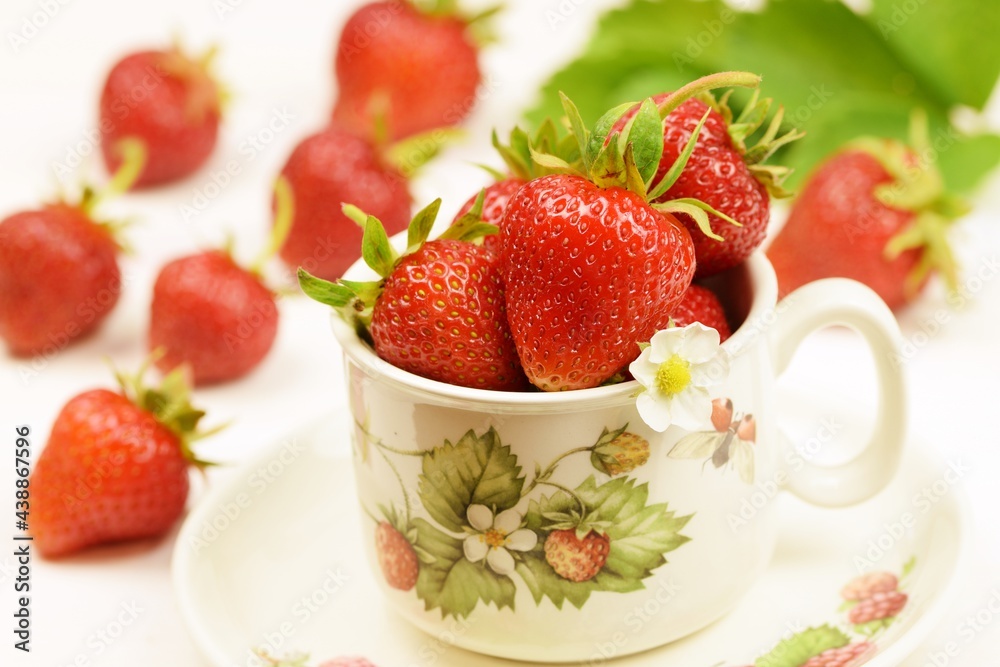 Strawberries in a cup, bokeh strawberry background, fresh strawberry fruits. Strawberries in a cup, bokeh strawberry background, fresh strawberry fruits.