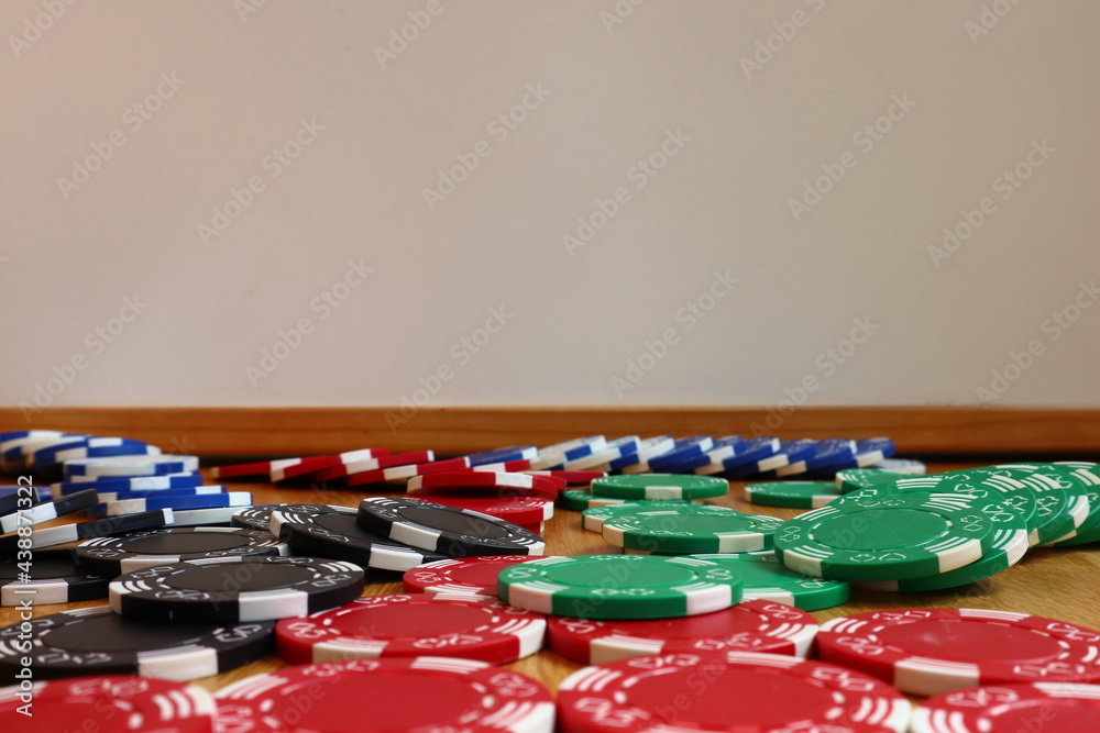 Spread out poker chips. Close up and isolated. Different colors. Area for copy space or extra text. Spread out poker chips. Close up and isolated. Different colors. Area for copy space or extra text.