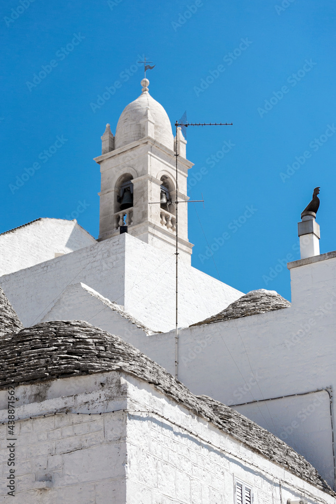 Alberobello, Puglia, Brindisi region, Southern Italy. View of the Famous village with typical dry stone Trulli houses and conical roof. Trulli picturesque street in the old town. Cone-roofed houses
