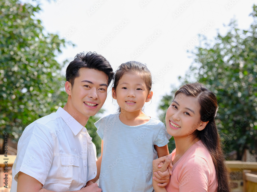 Obraz premium Happy family of three in the outdoor group photo