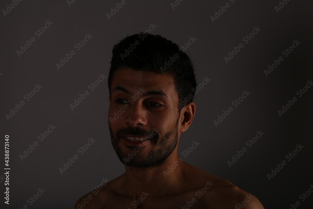 Portrait of a man on grey background