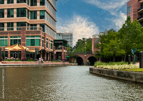 a view of office buildings from the Waterway in the Woodlands, TX