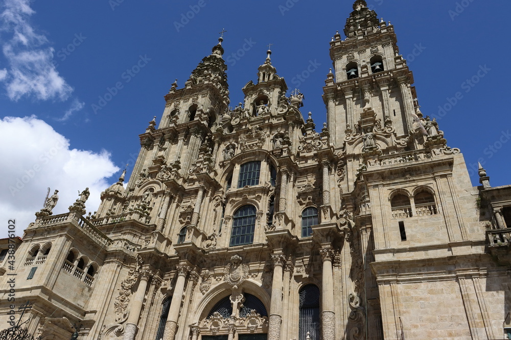 Main facade of the cathedral of Santiago de Compostela, on a sunny day.
