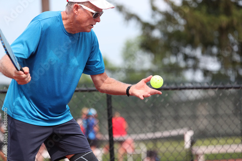 A ball is tossed during a serve.