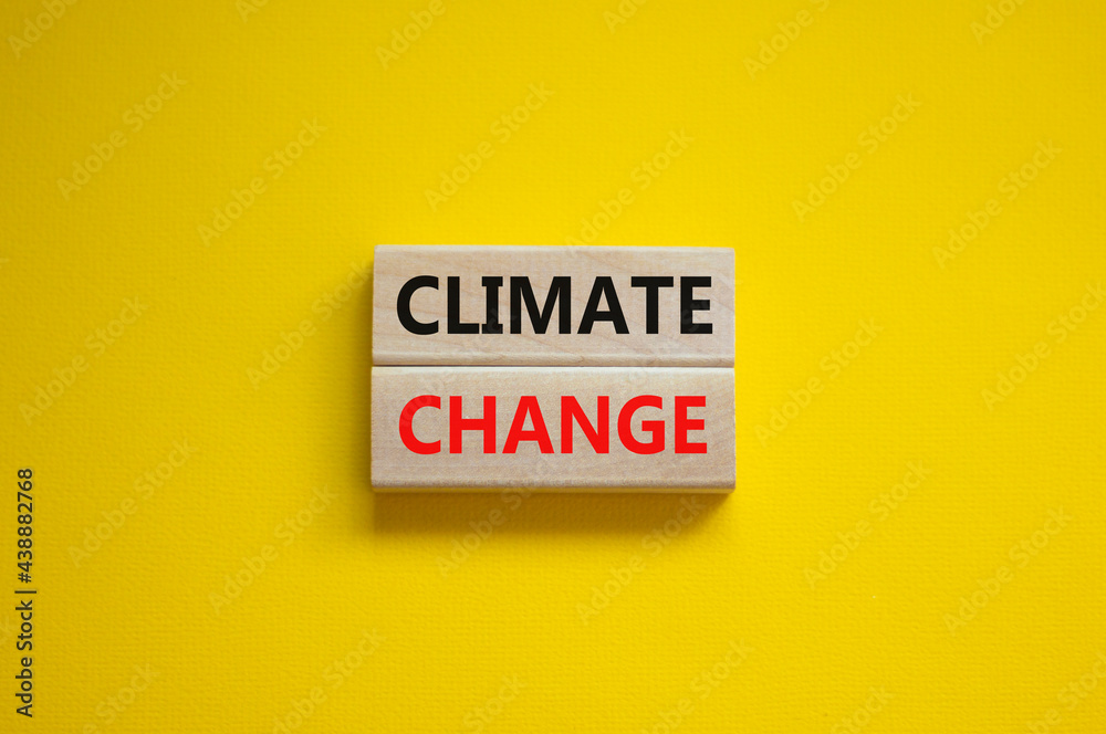 Climate change symbol. Wooden blocks with words 'Climate change' on beautiful yellow background. Business, ecological and climate change concept. Copy space. Climate change symbol. Wooden blocks with words 'Climate change' on beautiful yellow background. Business, ecological and climate change concept. Copy space.