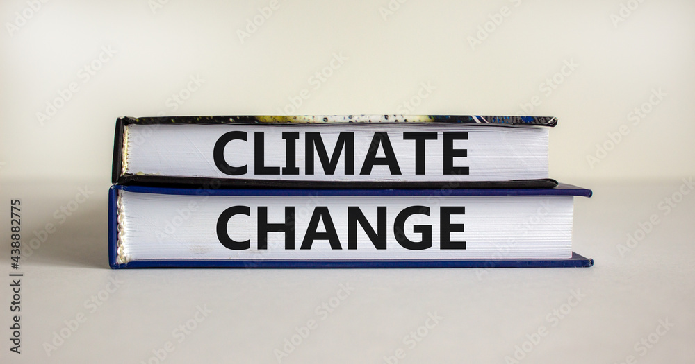 Climate change symbol. Books with words 'Climate change' on beautiful canvas background. Business, ecological and climate change concept. Copy space.