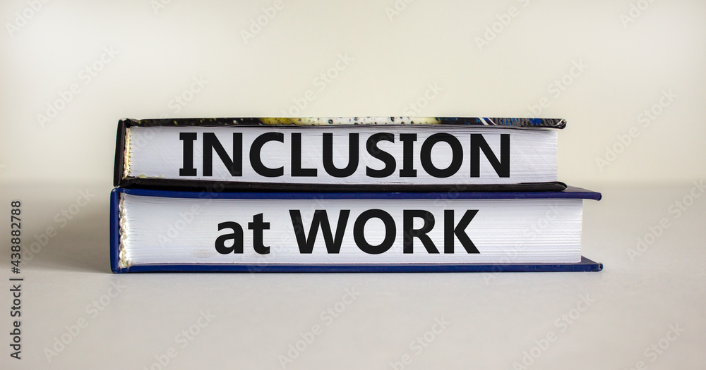 Inclusion at work symbol. Books with words 'Inclusion at work' on beautiful white background. Business, inclusion at work concept. Copy space.