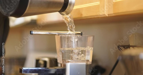 Measuring distilled water for coffee maker, Close Up
