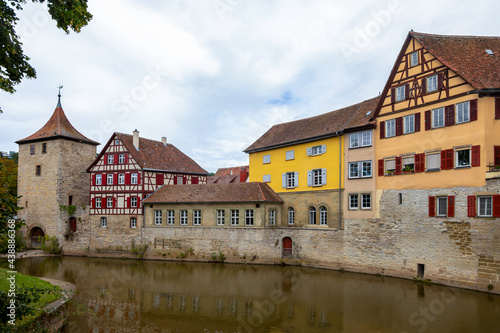 Old tower and historic, medieval half-timbered houses in the historic center of Schw bisch Hall on the Kocher river, Baden-Wurttemberg, Germany.