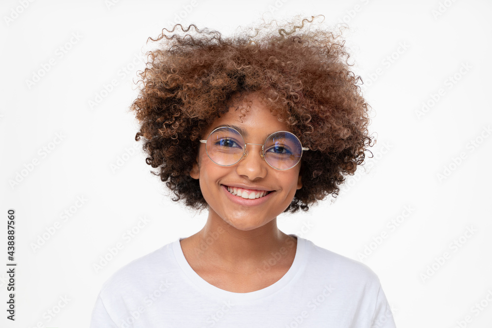 Close-up portrait of smiling african student girl in white t-shirt and round glasses, isolated on gray background Close-up portrait of smiling african student girl in white t-shirt and round glasses, isolated on gray background