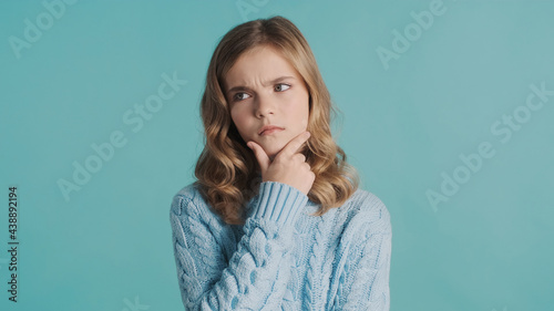 Photos Thoughtful teenager girl looking worry keeping hand on chin thin