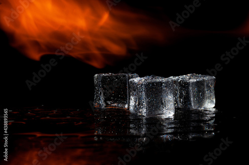 Fototapeta Naklejka Na Ścianę i Meble -  fire and water, flames and ice, black background