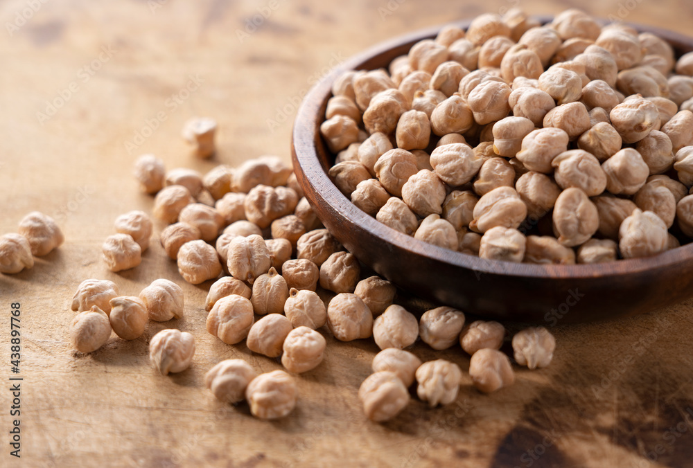 Dried chickpeas on a wooden background. Dried chickpeas on a wooden background.