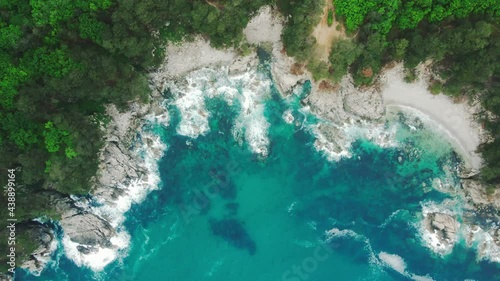 View from above. Far Eastern Marine Reserve. The camera hovers over a beautiful rocky coastline with a turquoise sea. photo