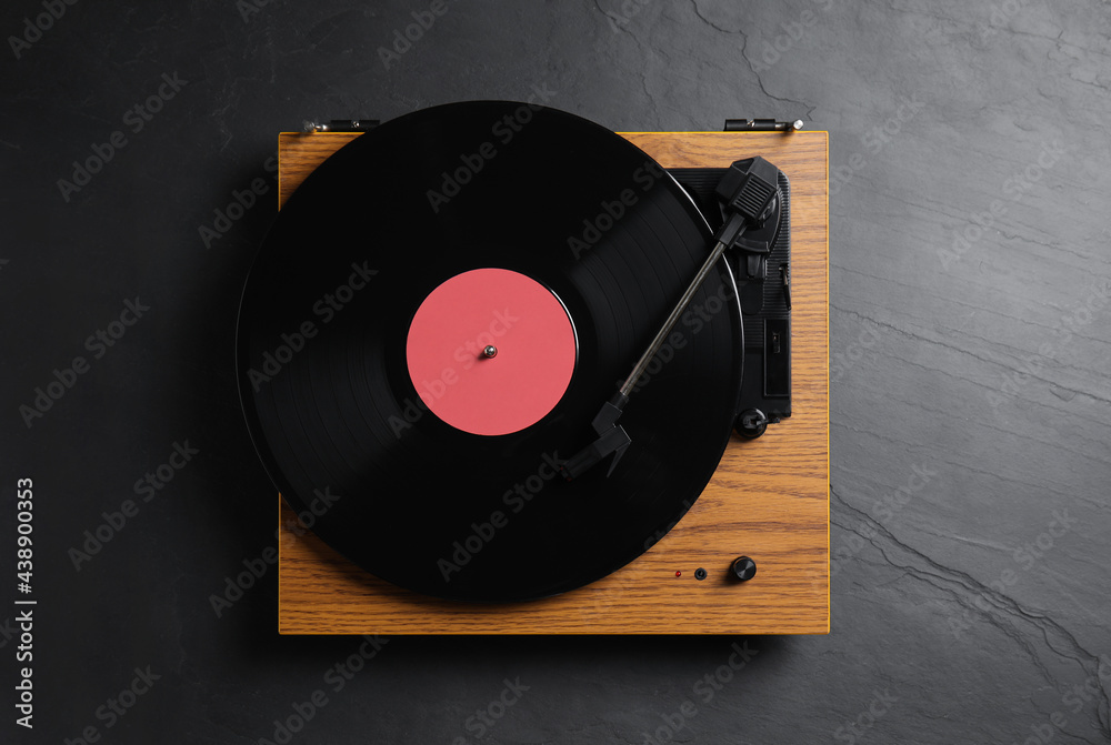 Obraz premium Modern vinyl record player with disc on black background, top view