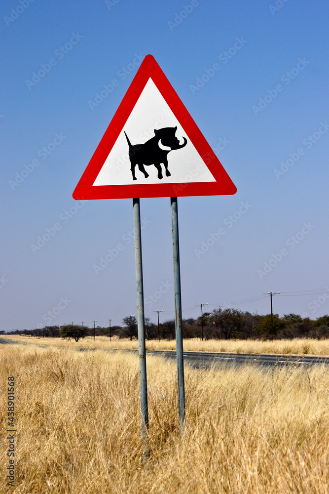 Warning sign for warthogs on highway, Namibia Warning sign for warthogs on highway, Namibia