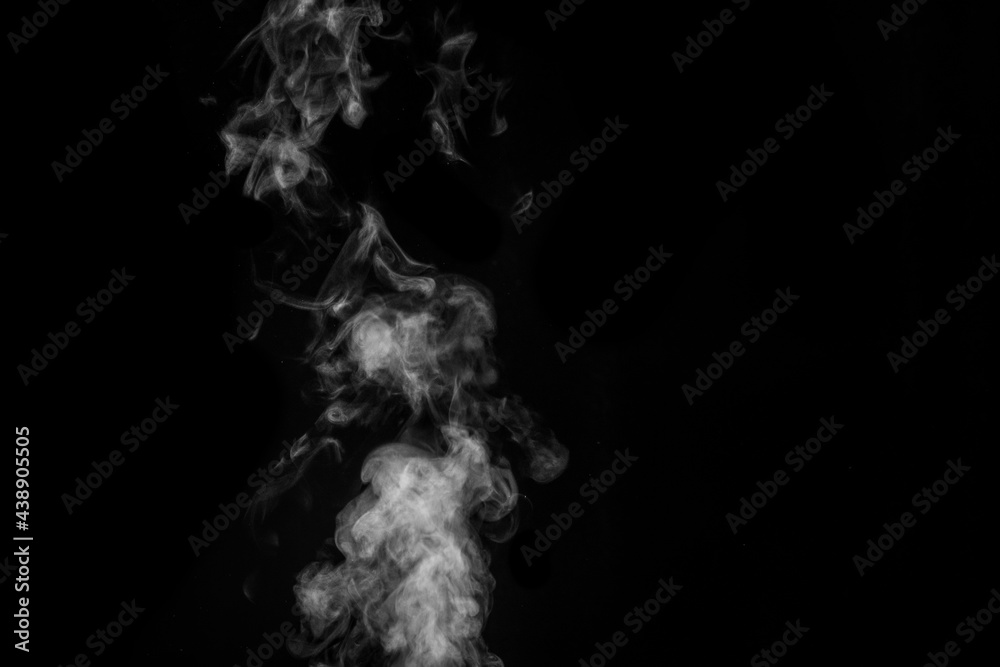 White smoke on black background. Figured smoke on a dark background. Abstract background, design element White smoke on black background. Figured smoke on a dark background. Abstract background, design element