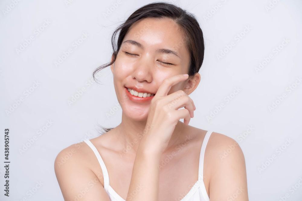 Beautiful young asian woman with clean fresh skin on white background. Asian women portrait. Beautiful young asian woman with clean fresh skin on white background. Asian women portrait.