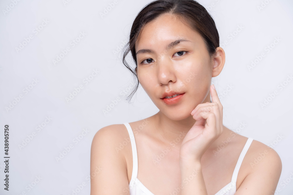 Beautiful young asian woman with clean fresh skin on white background. Asian women portrait. Beautiful young asian woman with clean fresh skin on white background. Asian women portrait.