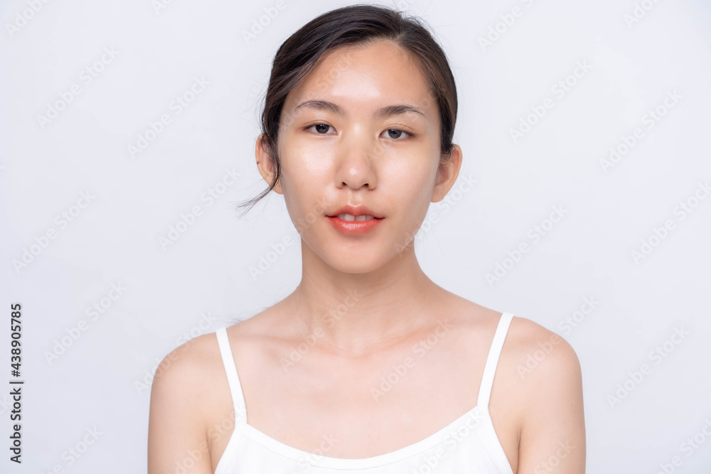 Beautiful young asian woman with clean fresh skin on white background. Asian women portrait. Beautiful young asian woman with clean fresh skin on white background. Asian women portrait.