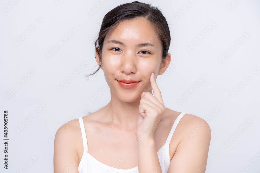Beautiful young asian woman with clean fresh skin on white background. Asian women portrait. Beautiful young asian woman with clean fresh skin on white background. Asian women portrait.