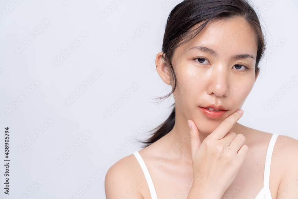 Beautiful young asian woman with clean fresh skin on white background. Asian women portrait. Beautiful young asian woman with clean fresh skin on white background. Asian women portrait.
