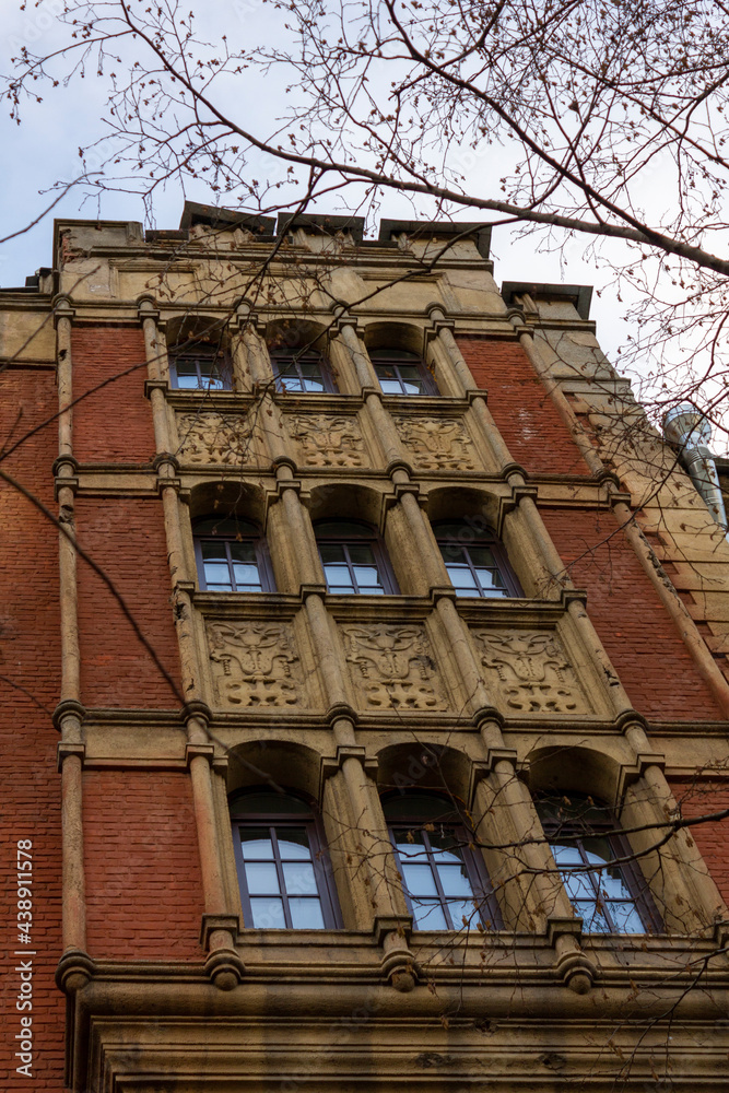 Fototapeta premium old brick building with bas-reliefs Saint Petersburg