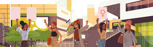 mix race activists holding placards with female gender sign feminist demonstration girl power movement rights protection women empowerment concept portrait cityscape background horizontal