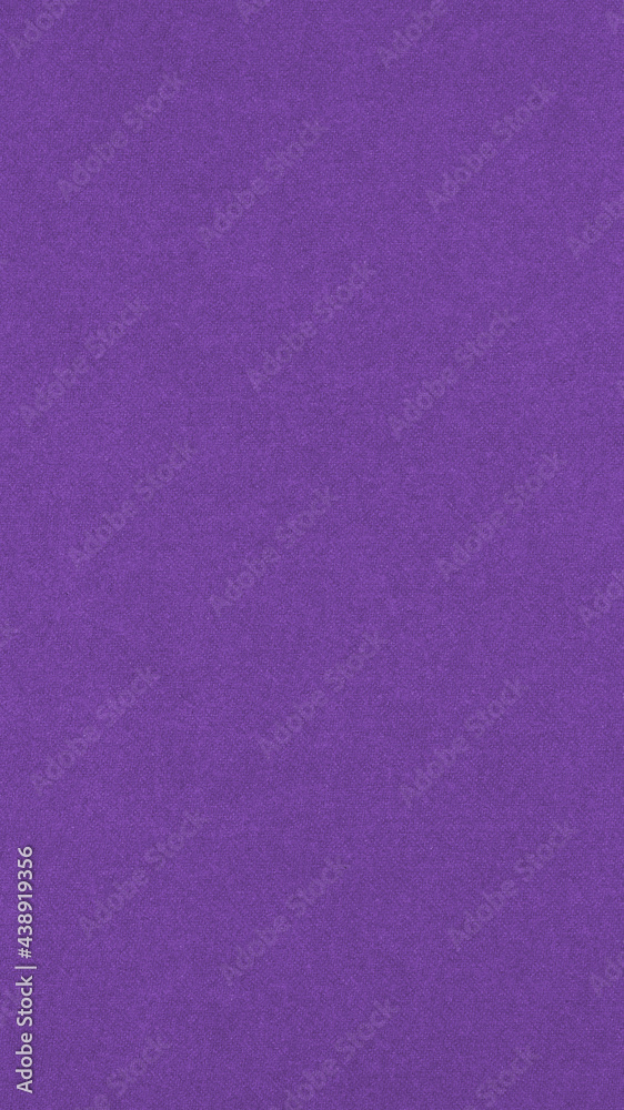 Purple colored paper texture. Bright summer mobile phone wallpaper. Deep violet vertical background. Textured surface, fibers and irregularities are visible. Top-down