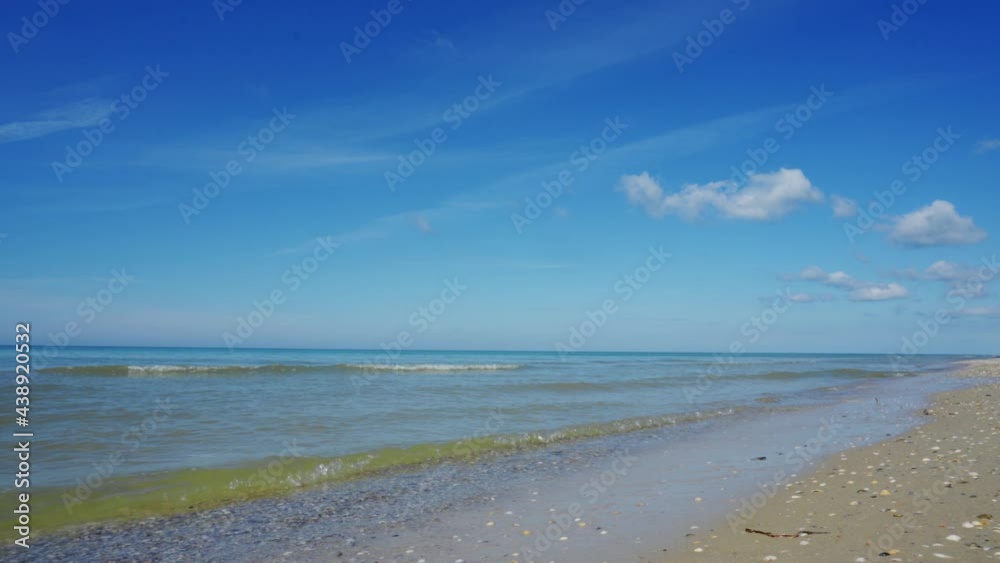 Sandy seashore or ocean. Clear water in the warm summer sun. A place of rest and relaxation. Sandy seashore or ocean. Clear water in the warm summer sun. A place of rest and relaxation.
