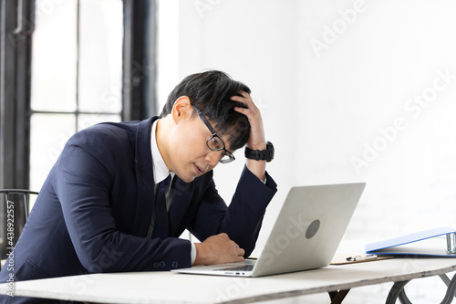 frustrated stressed businessman feeling tired and headache from hard work
