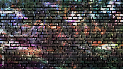 Colorful graffiti on a brick wall as a dark background