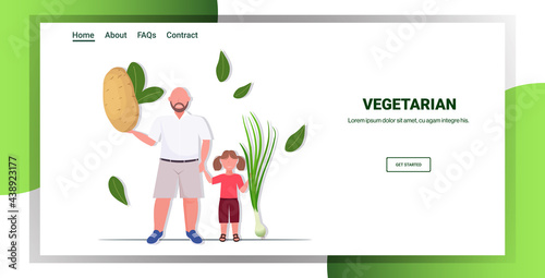 father with daughter holding potato onion vegetables healthy lifestyle vegan fresh raw food vegetarian concept copy space horizontal full length