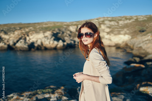 traveler near the sea in the mountains in nature and blue sea clouds sky © SHOTPRIME STUDIO