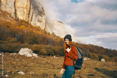pretty woman with a backpack in the fall in the mountains jeans hat leisure relax © SHOTPRIME STUDIO