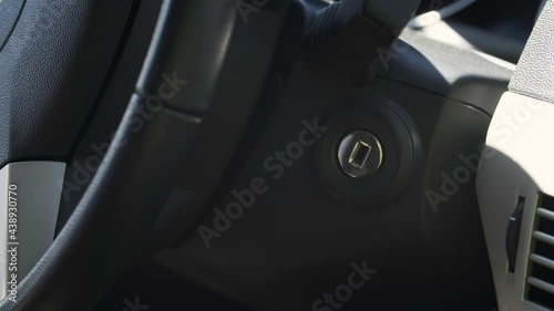 Close-up stopping car engine. Turn off engine.