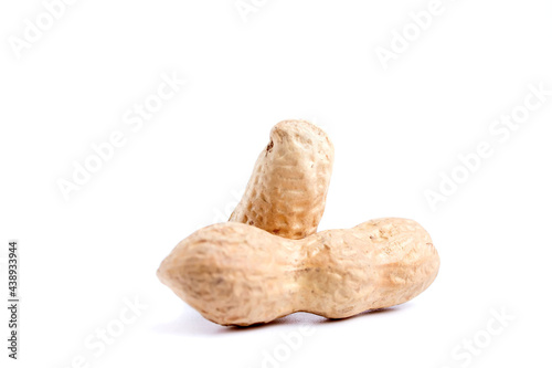 Peeled peanuts and peanut pod isolated on white background.