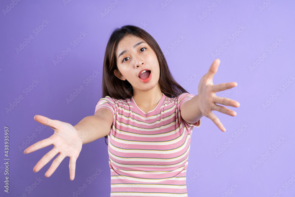 beautiful asian woman portrait, isolated on purple background
