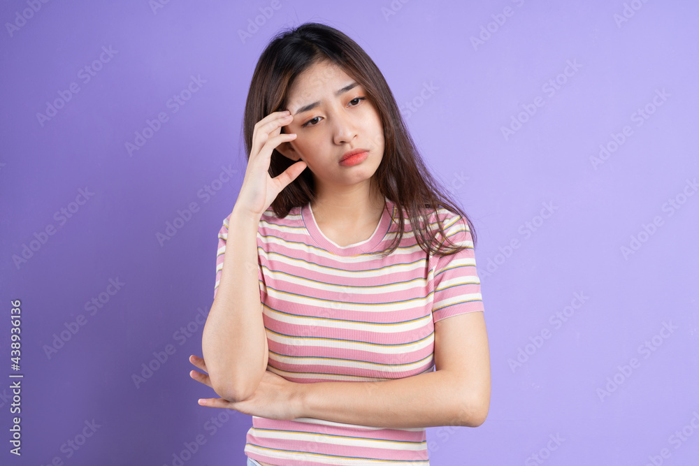 beautiful asian woman portrait, isolated on purple background beautiful asian woman portrait, isolated on purple background