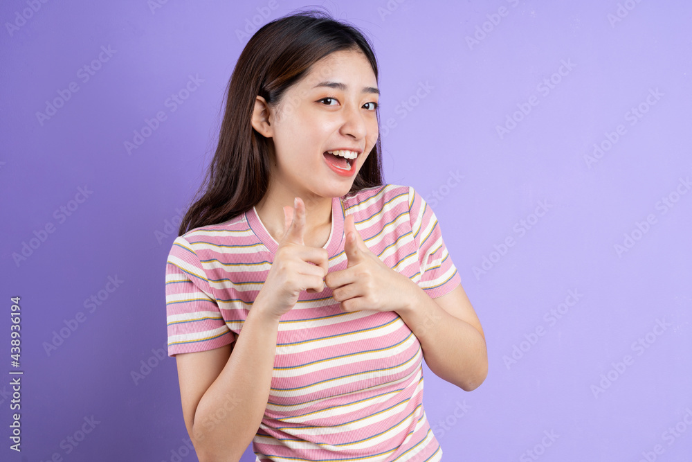 beautiful asian woman portrait, isolated on purple background beautiful asian woman portrait, isolated on purple background