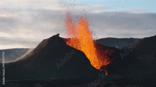 Fountain of magma erupting from volcano crater, Fagradalsfjall in Iceland. Slow-motion photo