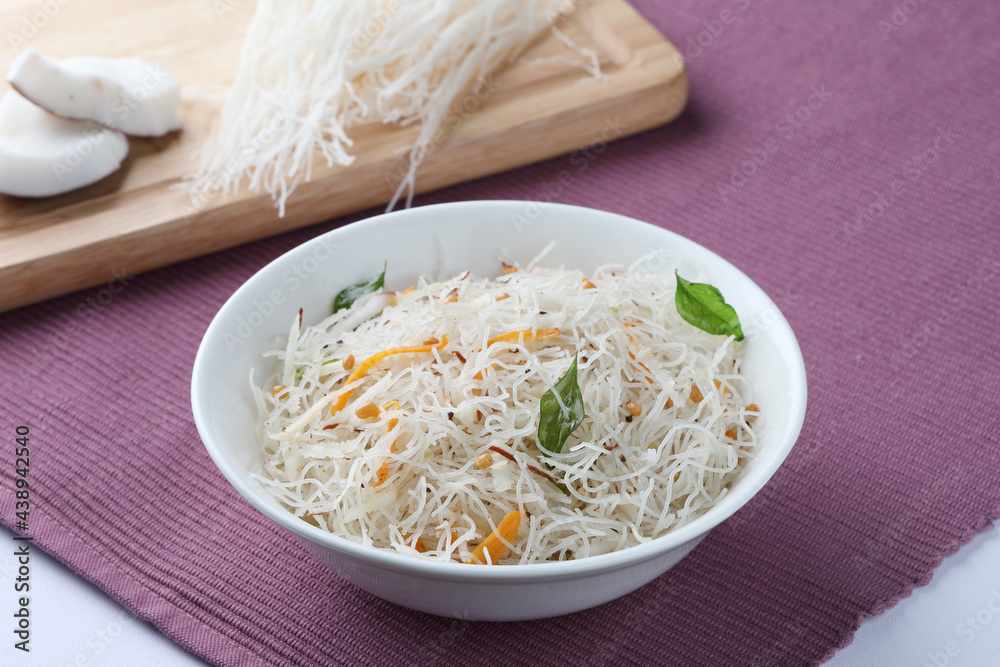 Rice Vermicelli cooked with coconut. Healthy south Indian breakfast Rice Vermicelli cooked with coconut. Healthy south Indian breakfast