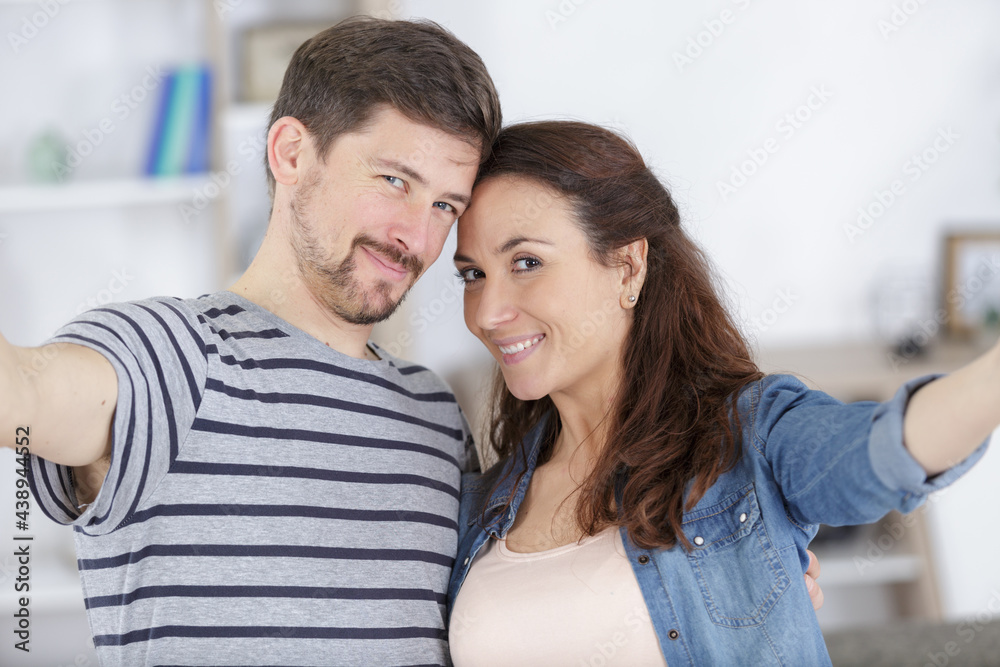 a couple together at home weekend taking selfie photos cheerful a couple together at home weekend taking selfie photos cheerful